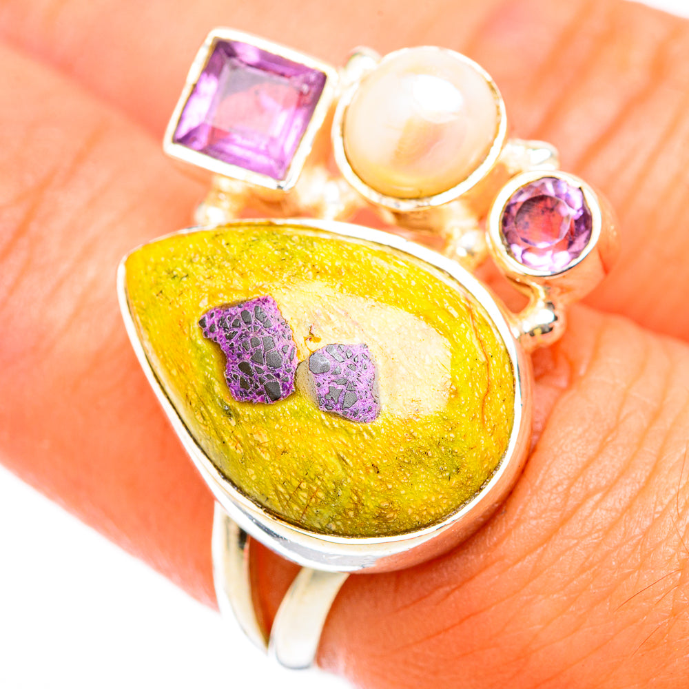 Sterling silver ring close-up: yellow teardrop cabochon, purple square, round stones, pearl