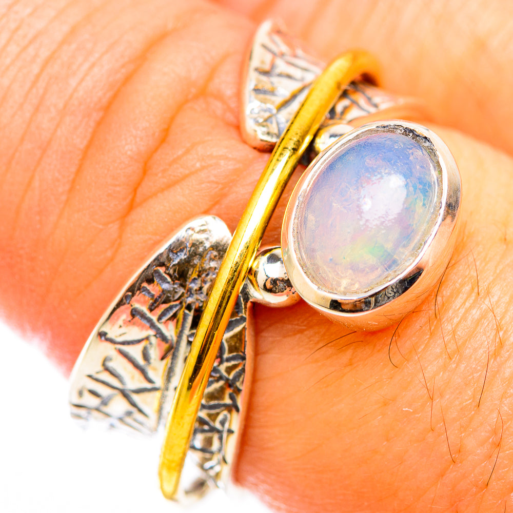 Sterling silver opal ring with oval Ethiopian opal and gold-toned double band