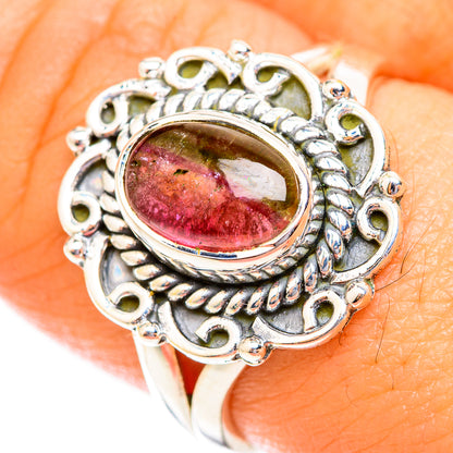 Silver-tone ring with oval pink-green-red tourmaline cabochon and ornate bezel
