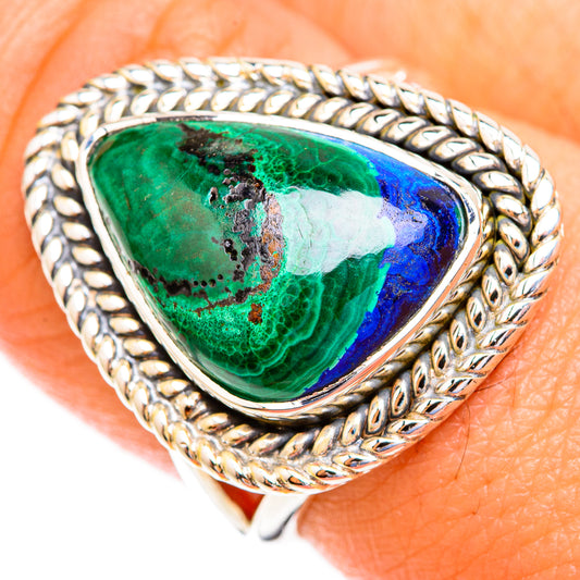 Sterling silver ring with teardrop green-and-blue stone on detailed braided setting