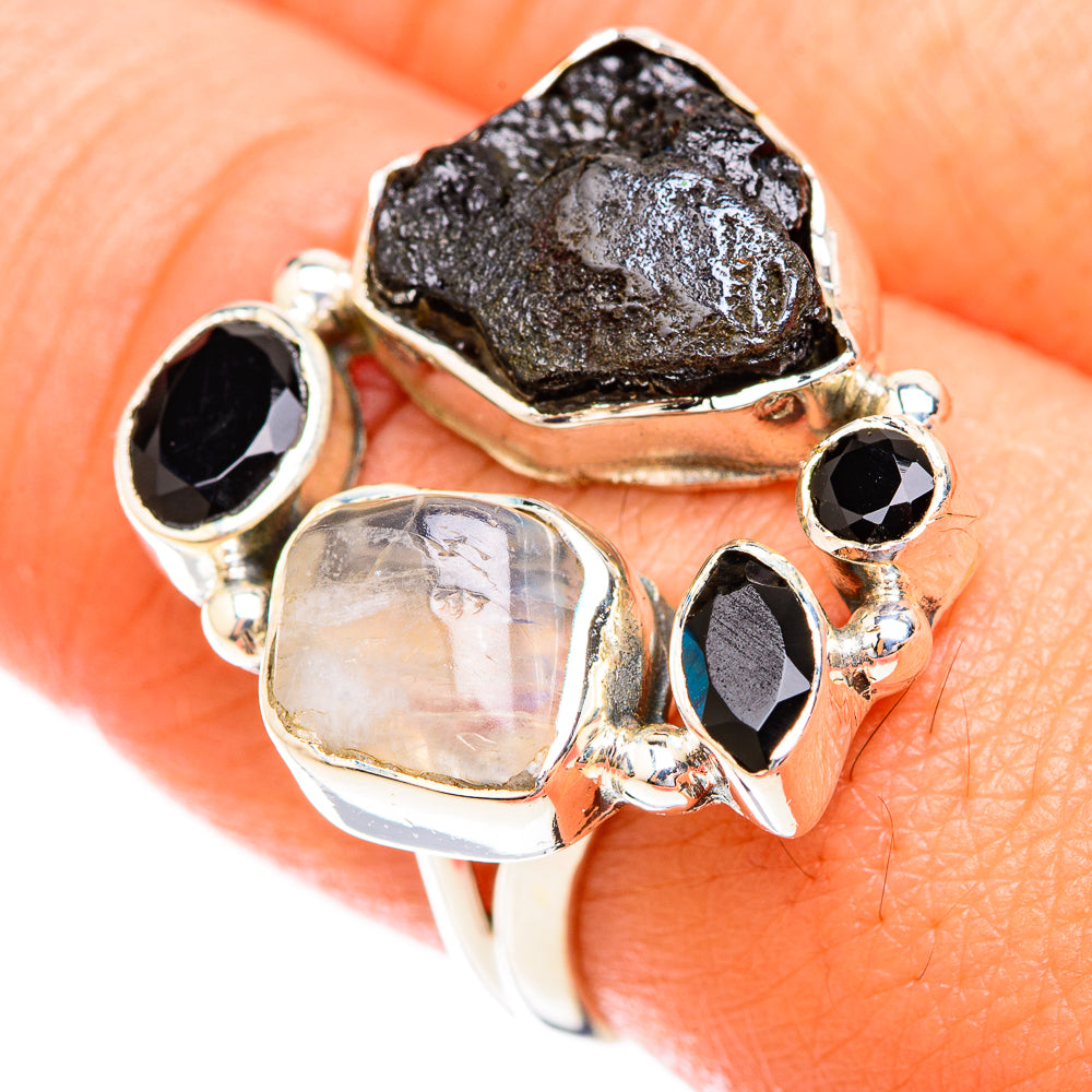 925 sterling silver ring with rough black center, oval black onyx, and iridescent moonstone