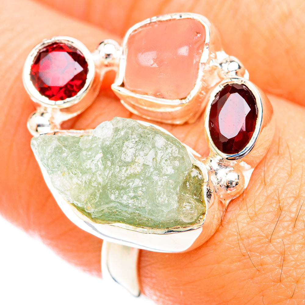 Sterling silver ring with round red, pink, and rough green stones on open setting