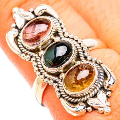 Sterling silver triple-stone ring with oval pink, dark green, and amber stones