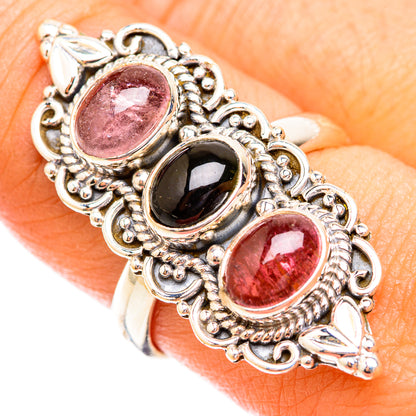 Sterling silver tourmaline ring close-up, showing pink and green oval cabochons