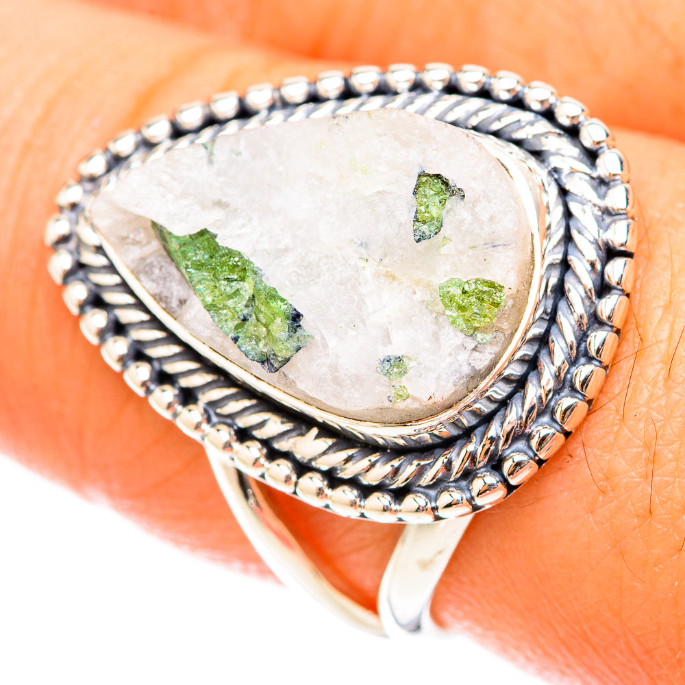 Sterling silver oval ring with green tourmaline-in-quartz, shown on finger