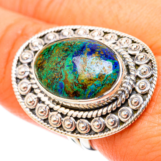 Close-up oval green-blue gemstone sterling silver ring, ornate scroll and beadwork