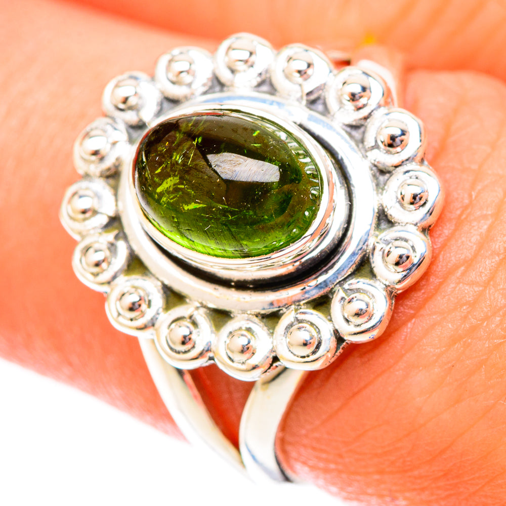Sterling silver oval green tourmaline ring with beaded halo setting
