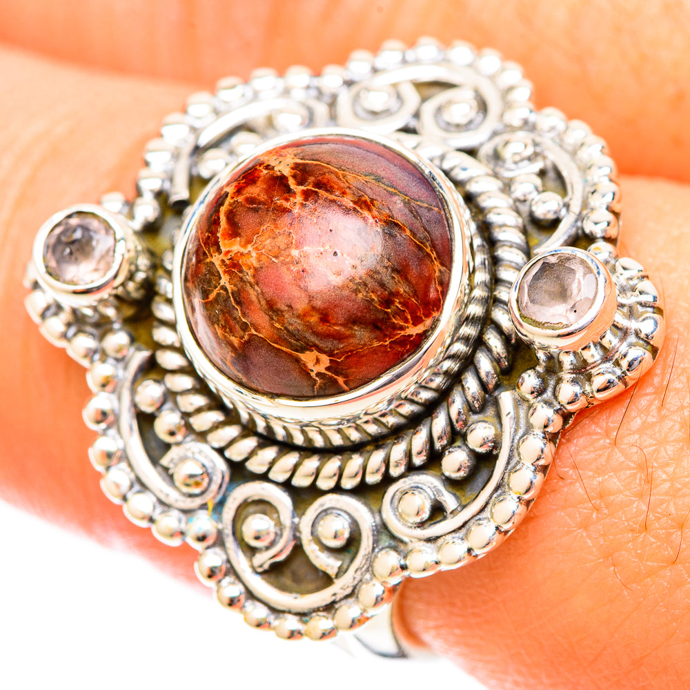 Sterling silver ring with round red-brown jasper cabochon in ornate filigree setting