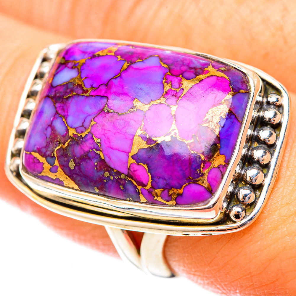 Silver ring with rectangular purple turquoise-style stone, gold veining, and round bezel