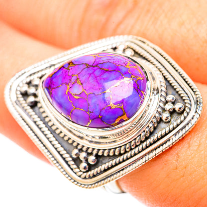 Oval purple turquoise cabochon ring with detailed silver filigree edge