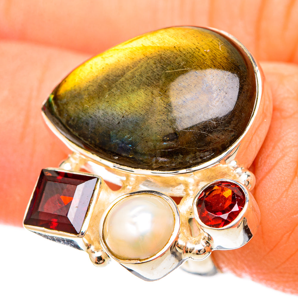 Sterling silver ring with oval labradorite, white pearl, and red garnet accents