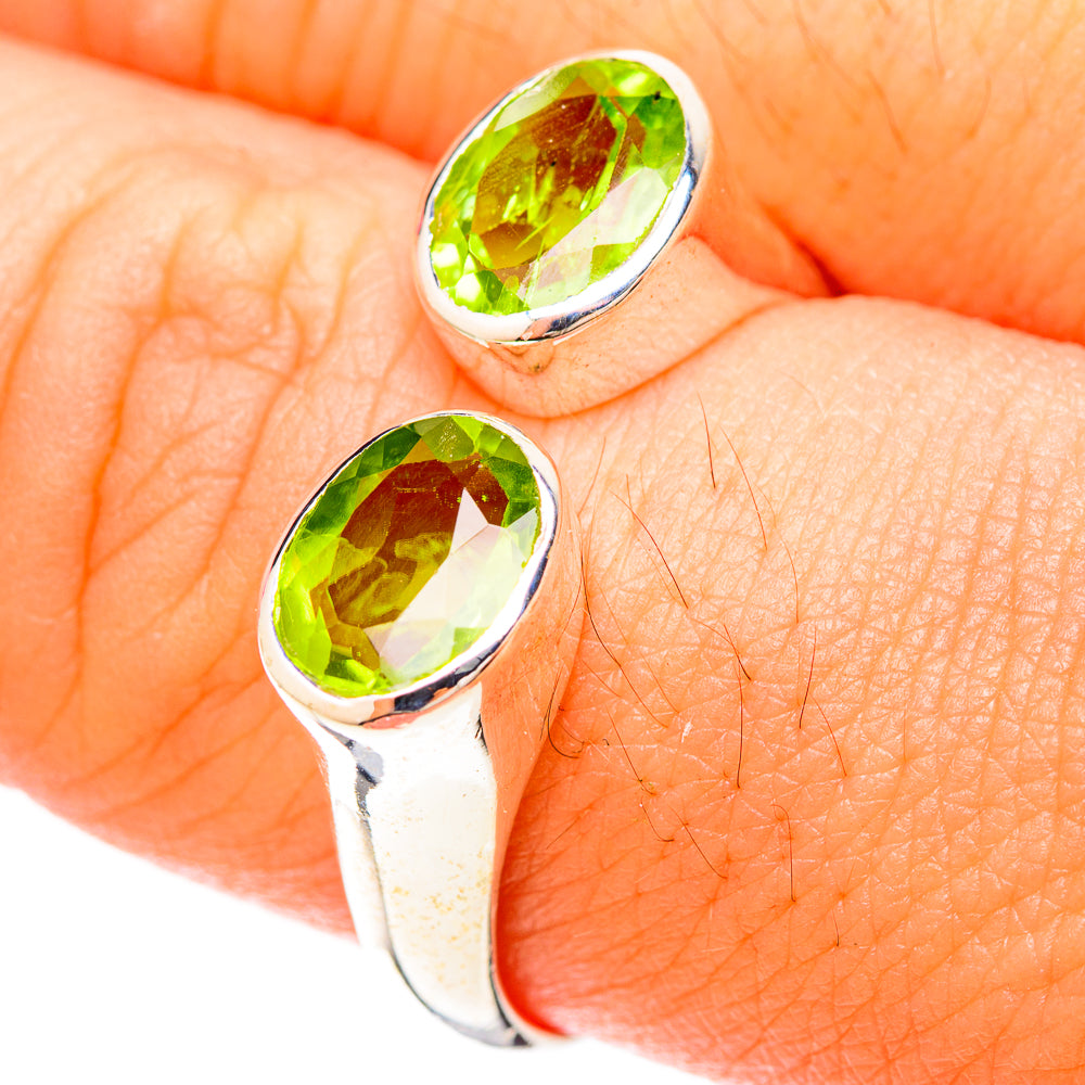 Peridot gemstone ring with oval green stone on polished 925 sterling silver band