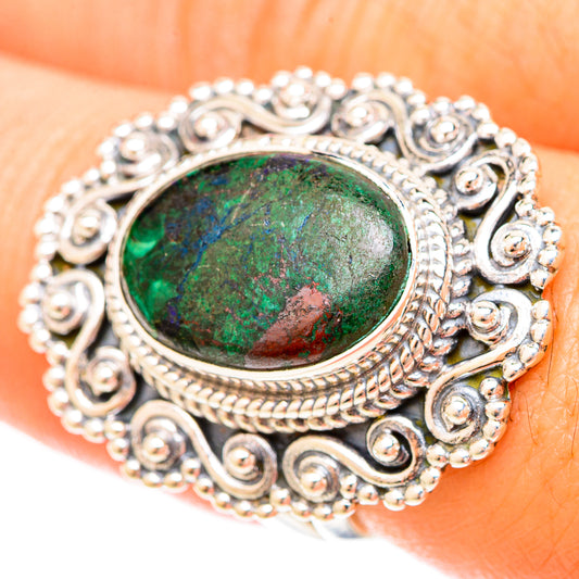Sterling silver ring with ornate filigree bezel and oval green malachite stone
