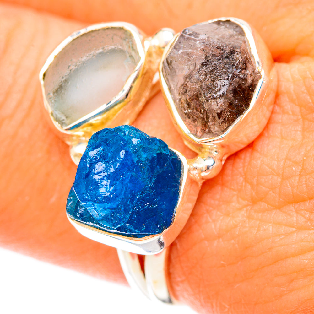 Sterling silver ring with rough blue, gray, and brown stones in bezel settings