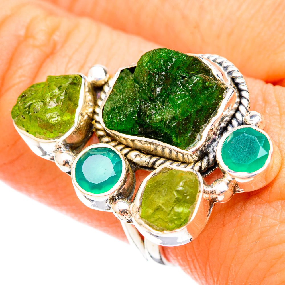 Sterling silver ring with rough green peridot and teal round gemstone accents