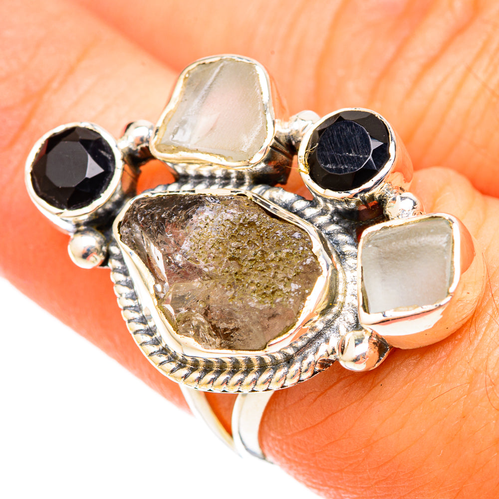Sterling silver ring with black onyx, moonstone-style accents, and a druzy oval centerpiece