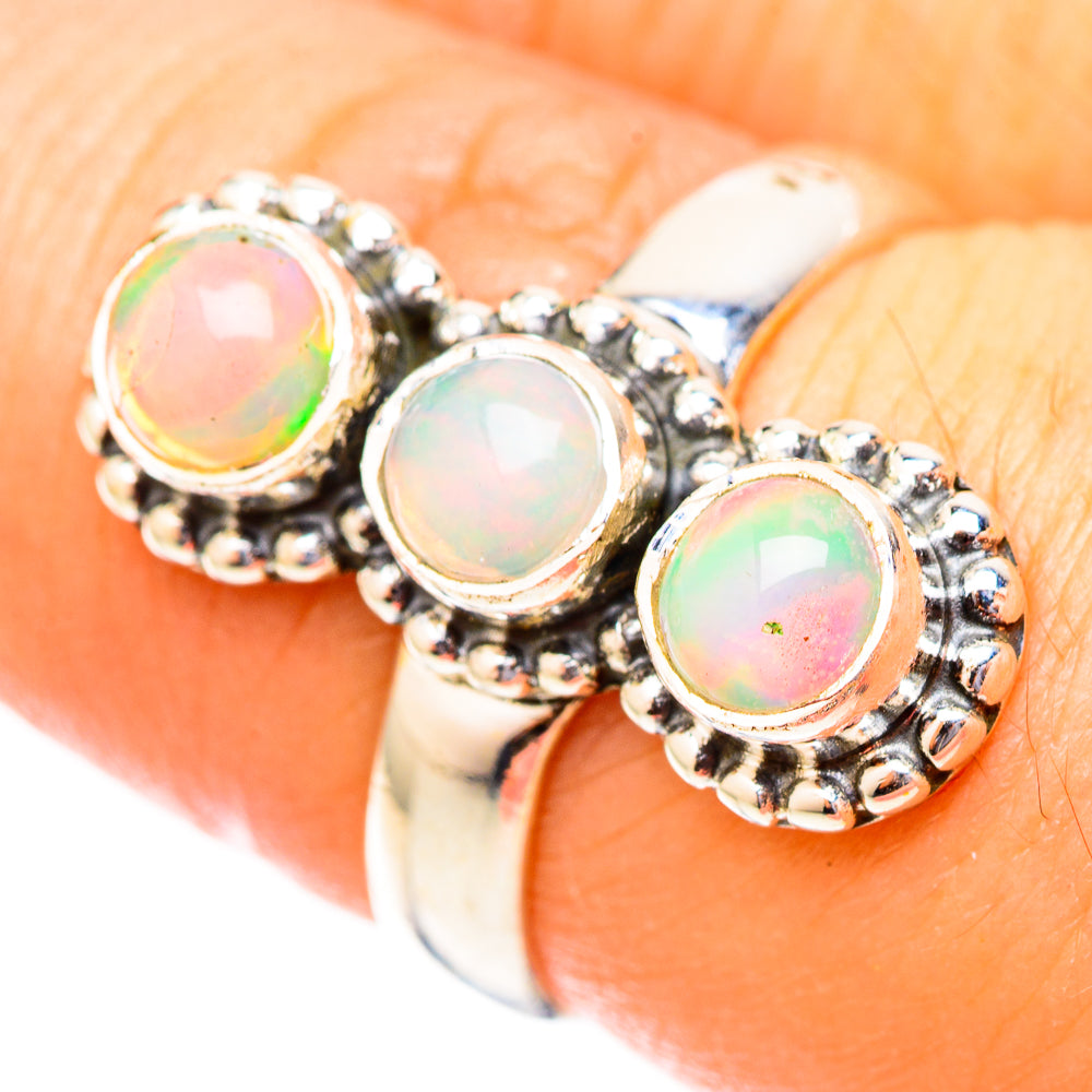 Sterling silver opal ring with three round iridescent opal cabochons