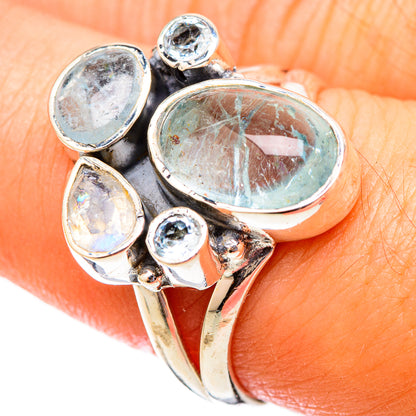 Sterling silver ring with oval blue aquamarine and round blue topaz accents