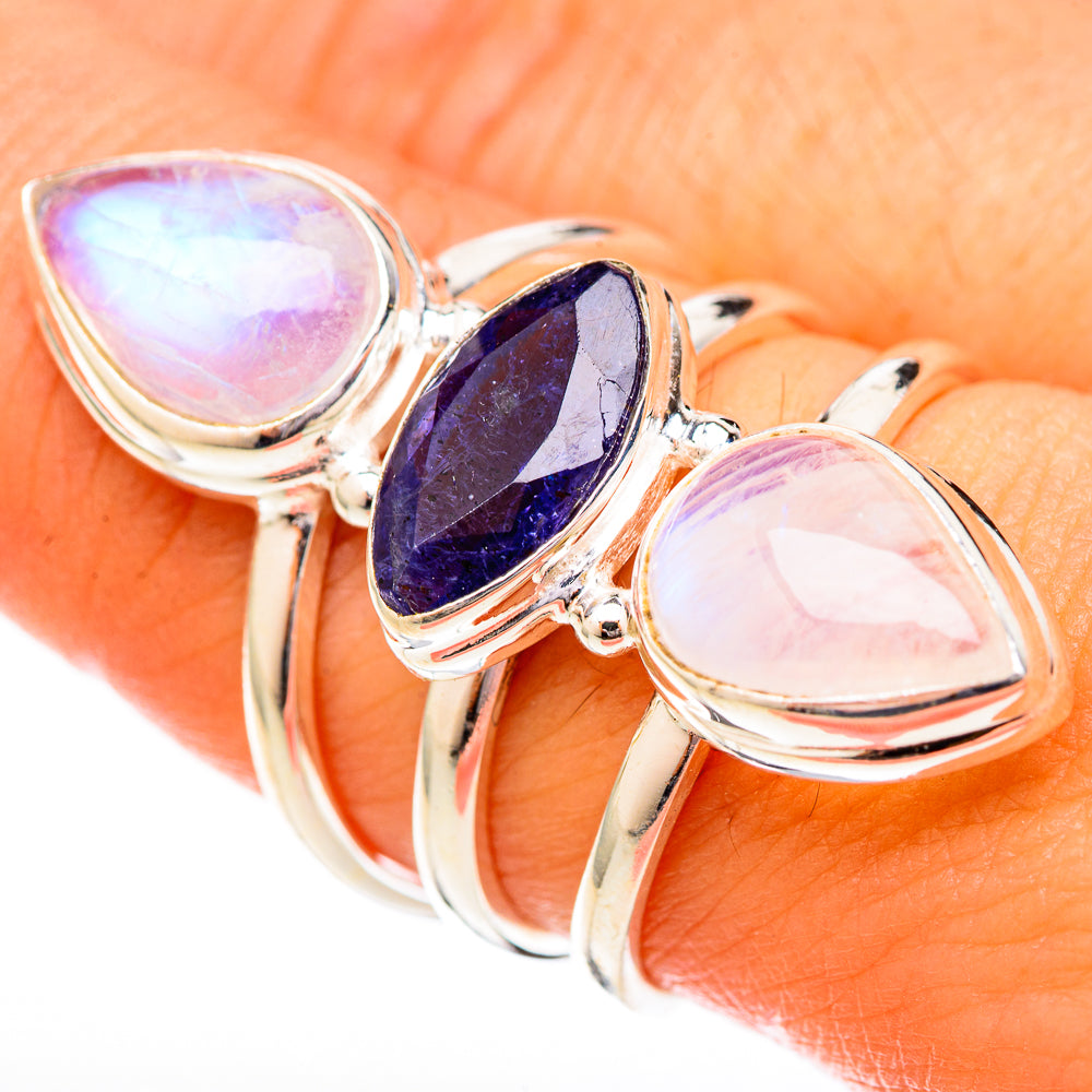 Sterling silver ring with rainbow moonstone and dark blue tanzanite, three-stone design