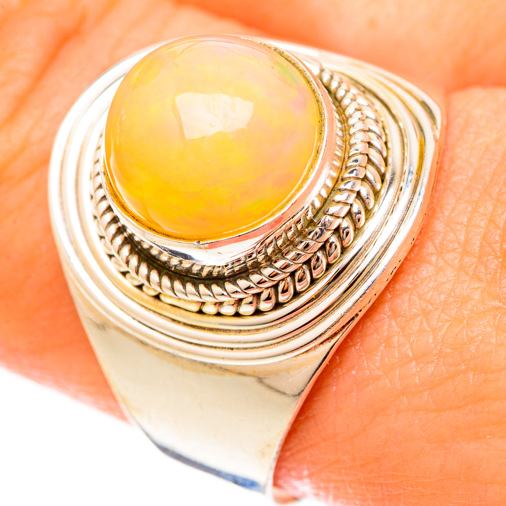 925 sterling silver opal ring with oval orange-yellow cabochon and rope-pattern band