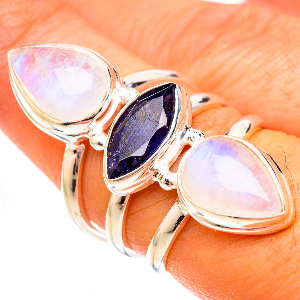Silver ring with oval rainbow moonstone and faceted dark blue center stone, size 7