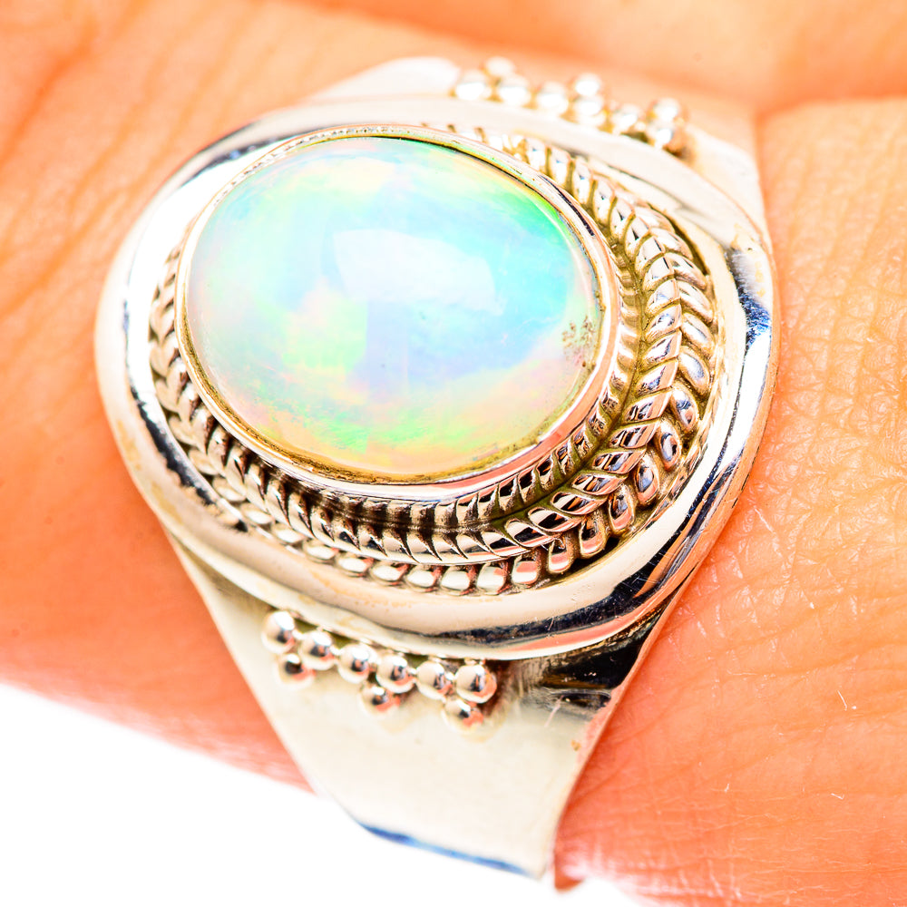 Sterling silver oval opal cabochon ring with engraved rope and bezel details