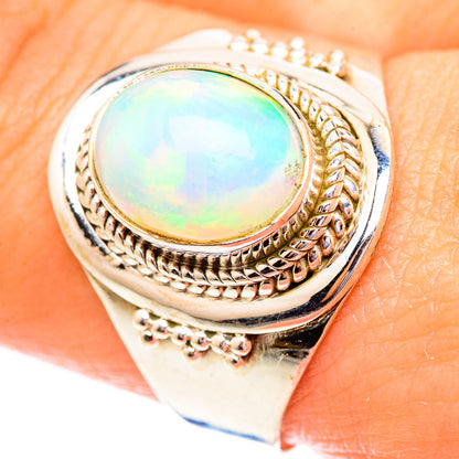 Sterling silver oval opal cabochon ring with engraved rope and bezel details