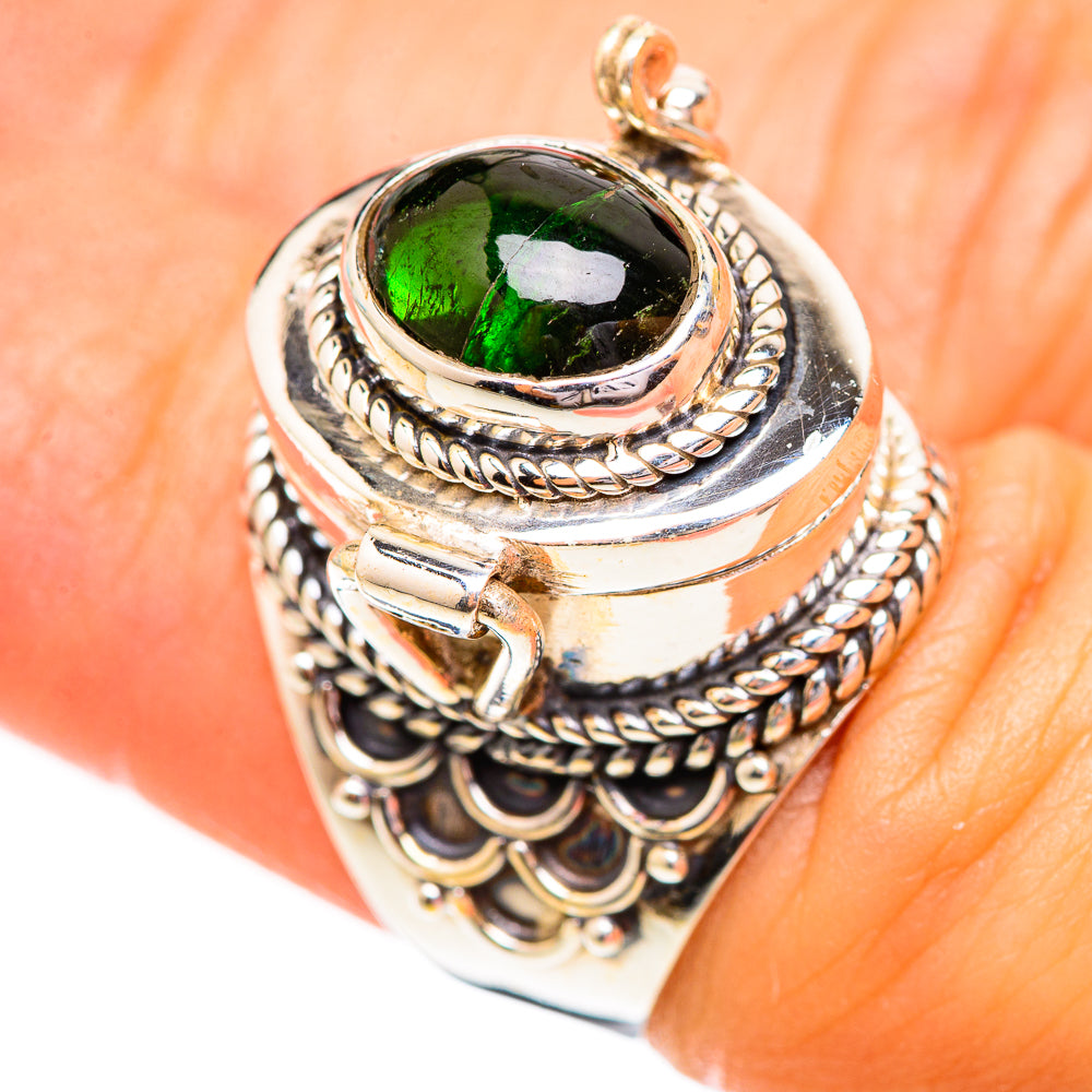 Sterling silver tourmaline ring with oval green stone and braided rope halo bezel