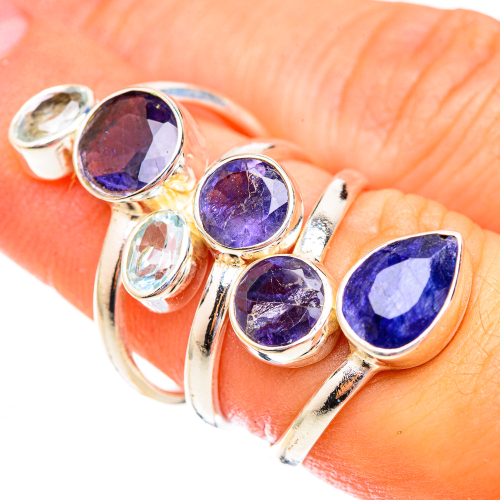 925 sterling silver ring with faceted purple round stones and blue oval gemstone