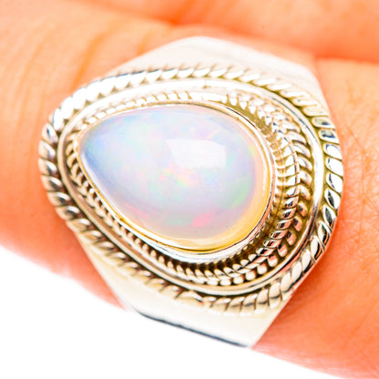 925 sterling silver oval opal ring with textured rope bezel and braided halo