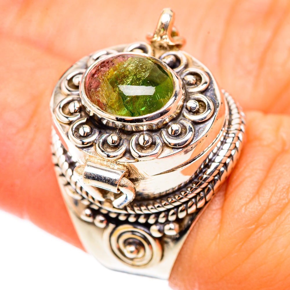Silver filigree ring with round green tourmaline cabochon and raised setting