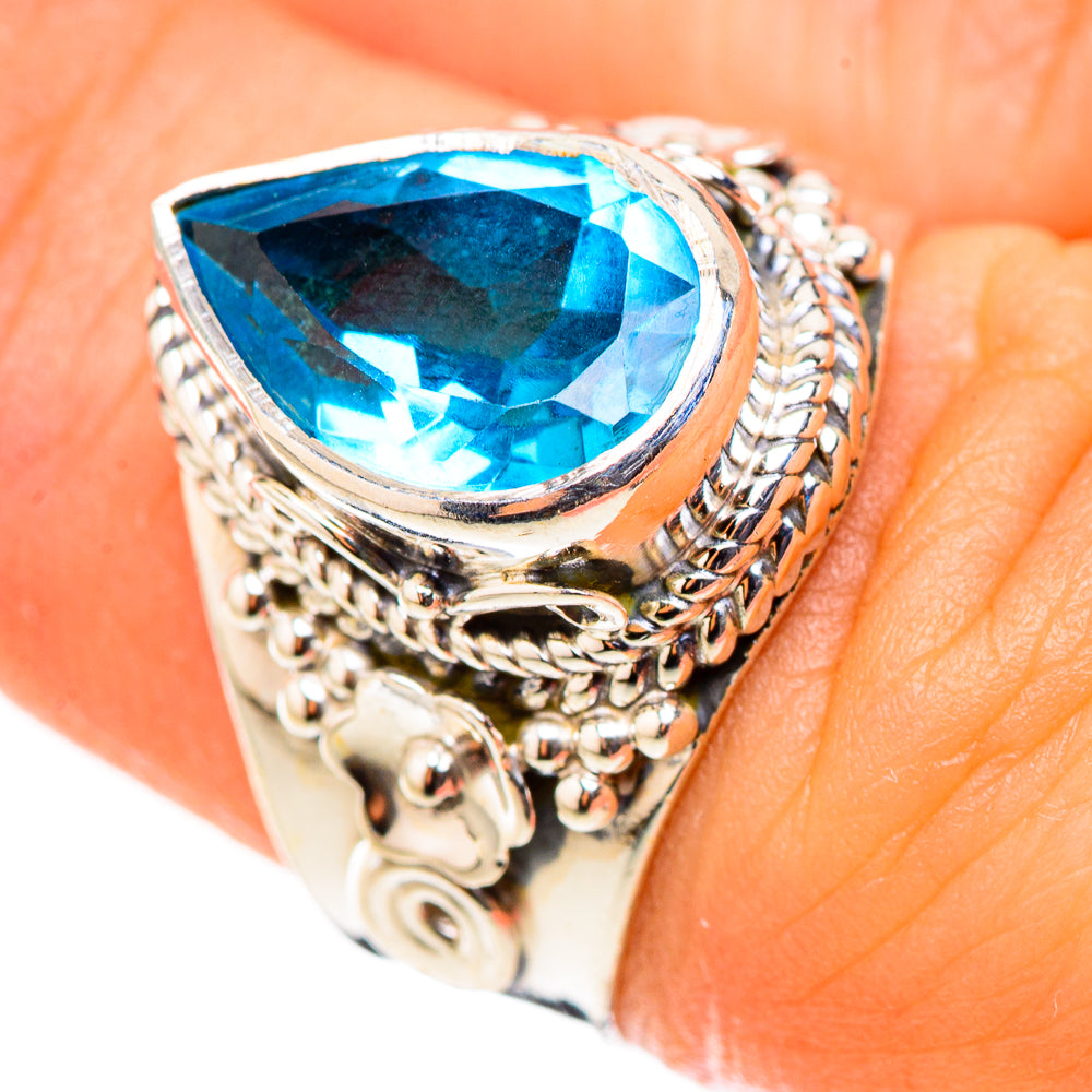 925 sterling silver ring with large oval blue topaz, braided halo and detailed side work