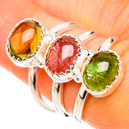 925 sterling silver three-stone tourmaline ring with oval green, red, and orange gems.