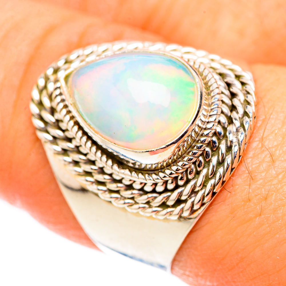 Sterling silver opal ring with oval opal cabochon and braided bezel, size 8.5