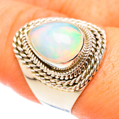 Sterling silver opal ring with oval opal cabochon and braided bezel, size 8.5
