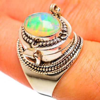 Silver opal ring featuring oval rainbow opal and textured rope pattern band, size 8
