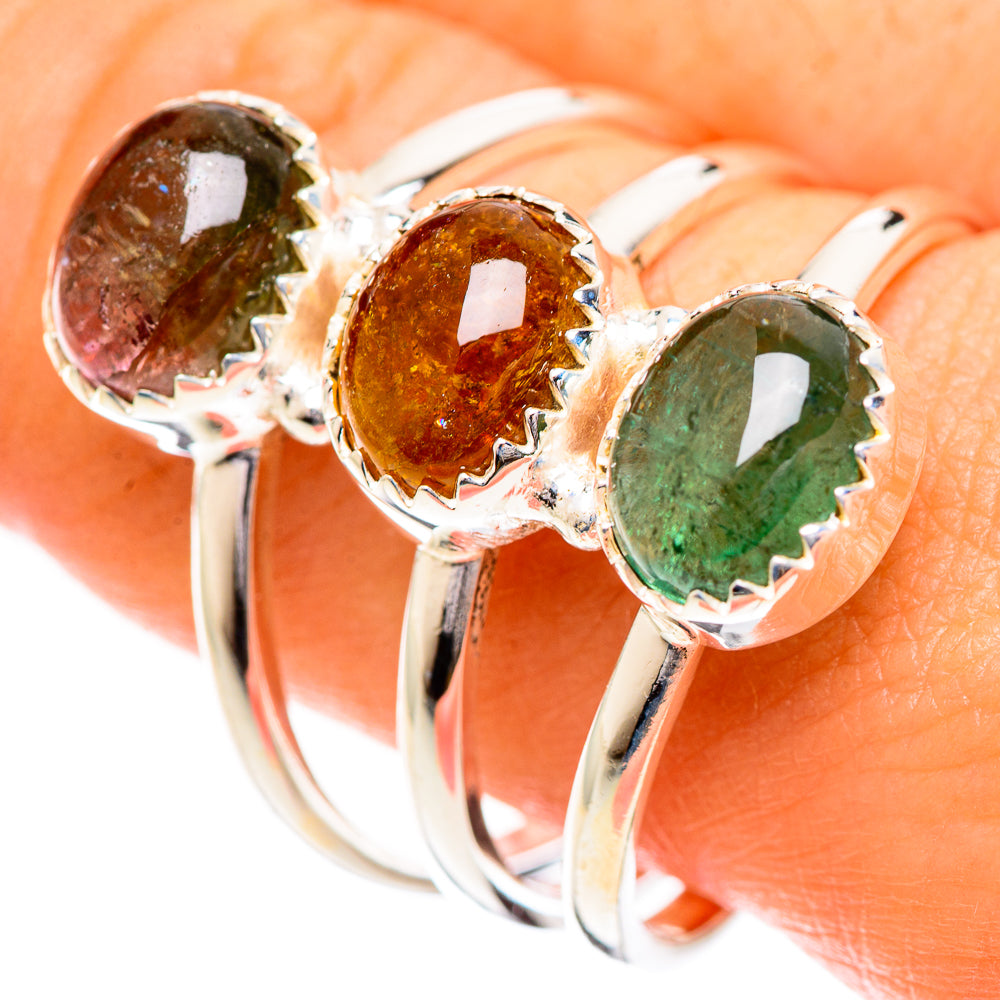 Sterling silver tourmaline ring with 3 prong-set stones: red-brown, amber, and green