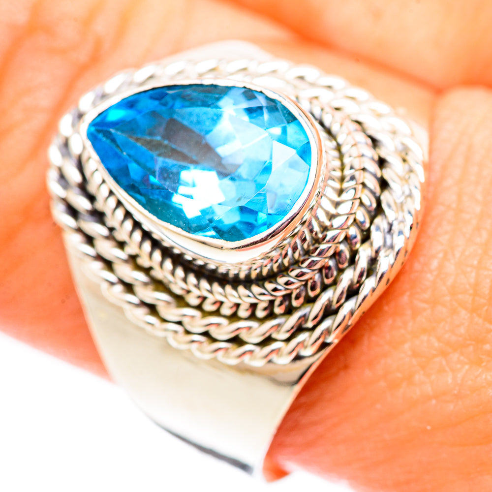 Sterling silver ring with large oval Swiss blue topaz and braided rope border, size 10.25