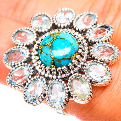 Turquoise cabochon ring with blue stone halo and silver prong setting