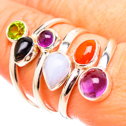 Sterling silver ring with oval stones: green, purple, orange, black, and white