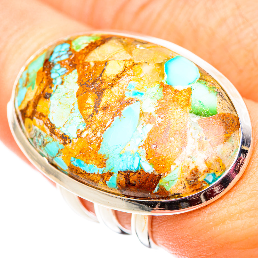 Oval turquoise composite cabochon ring with silver bezel, visible green and blue stones