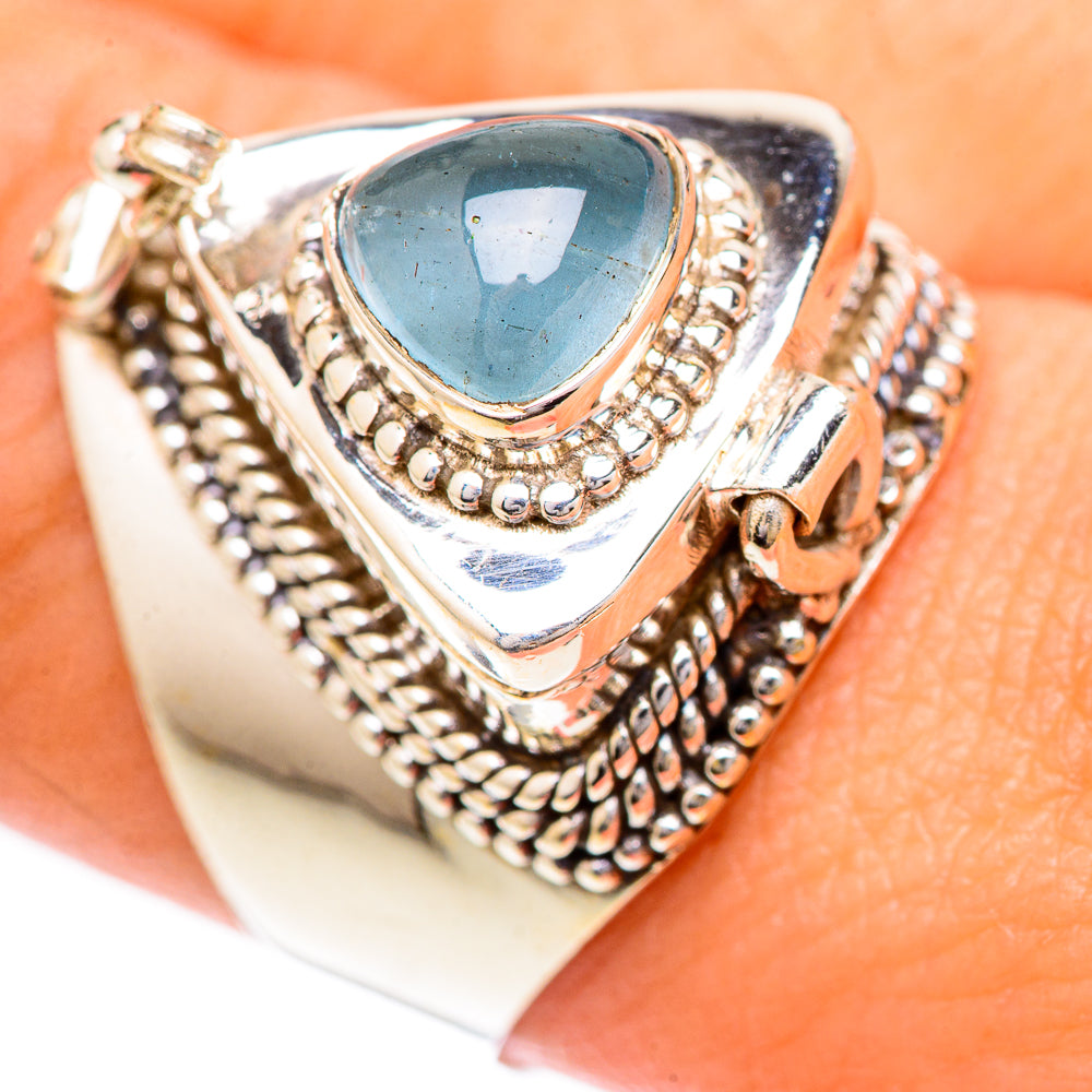 Sterling silver aquamarine cabochon ring with ornate rope bezel and oval blue stone