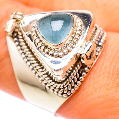Sterling silver aquamarine cabochon ring with ornate rope bezel and oval blue stone
