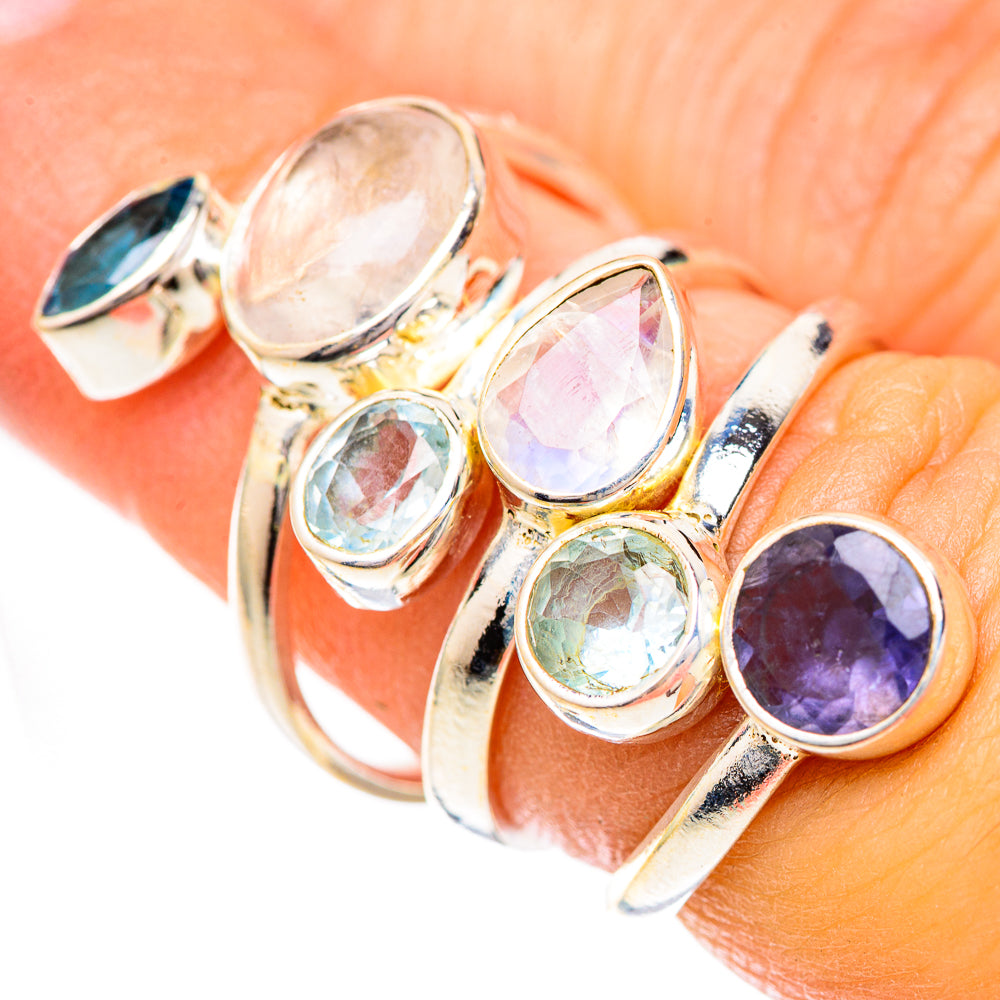 925 silver ring close-up with oval moonstone, purple tanzanite, and blue topaz stones