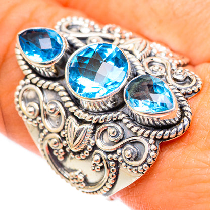 Sterling silver ring with three oval Swiss blue topaz stones and ornate filigree