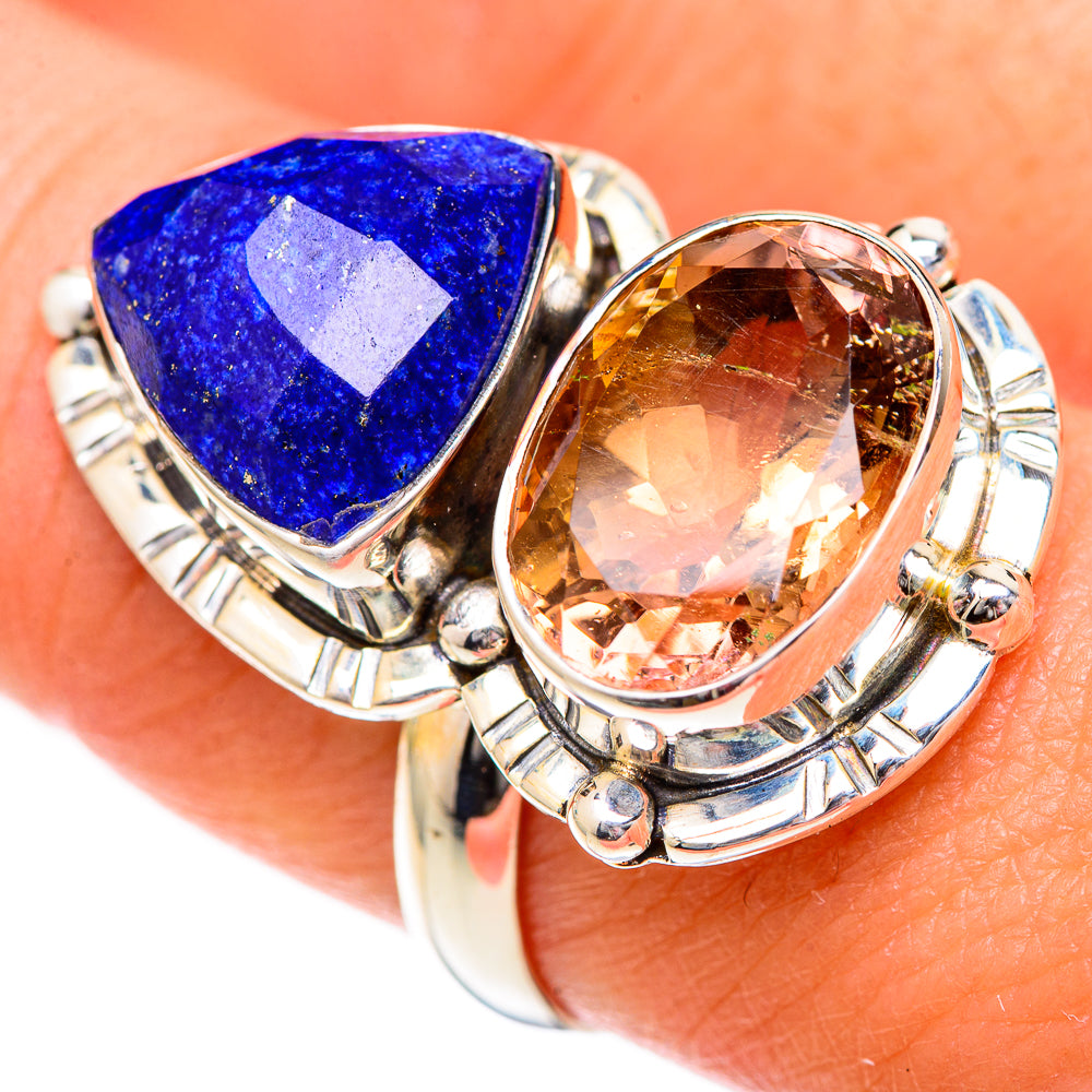 Sterling silver ring with blue pear-cut gemstone and orange-brown oval gemstone