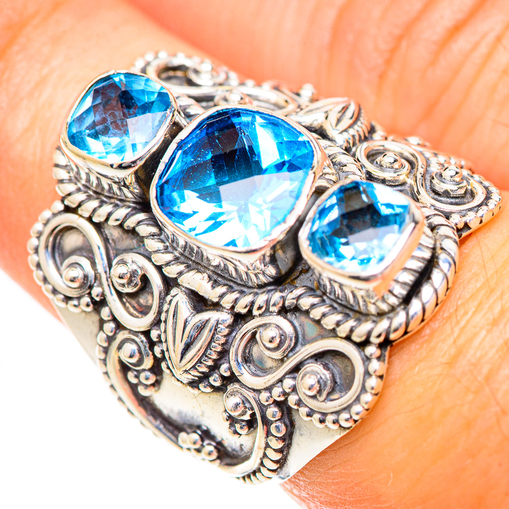 925 sterling silver ring with three blue gemstone settings and ornate filigree