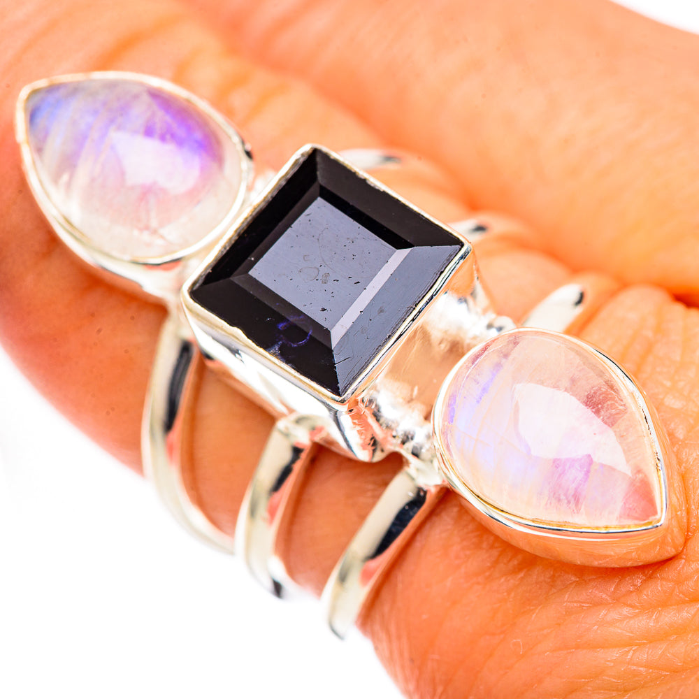Sterling silver ring with square black-blue center stone and two lavender opalescent ovals