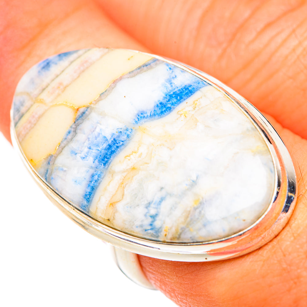 Oval blue-and-white scheelite stone ring, 925 sterling silver band close-up
