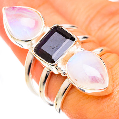 Sterling silver ring: blue faceted square stone, two pear rainbow moonstone cabochons